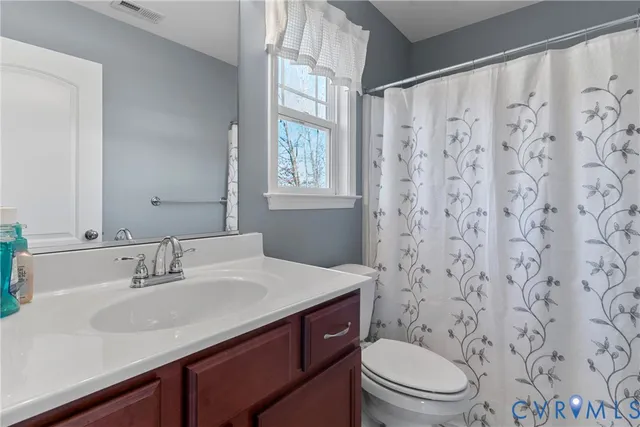 a bedroom with a bed and a table in it