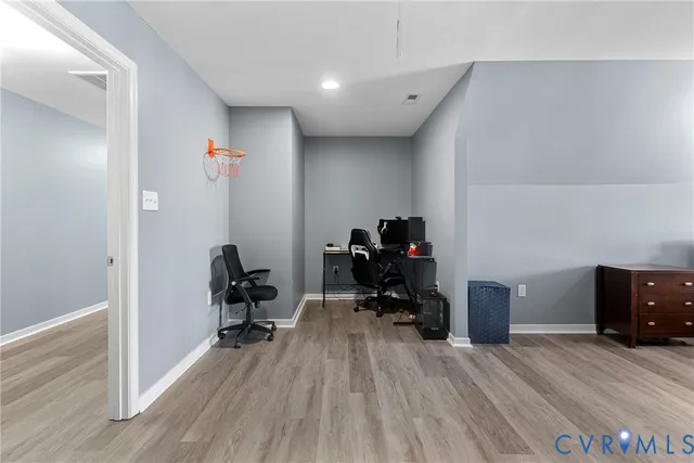 a view of entryway and hall with wooden floor