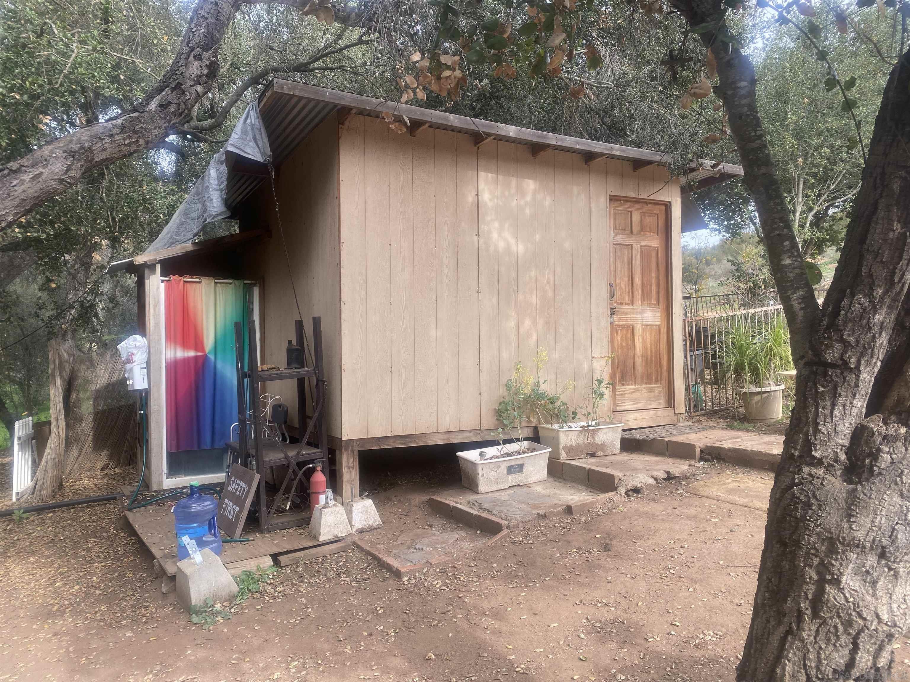 9 Lilac Road Valley Center, CA 92082 - Photo 22 of 27 a backyard of a house with barbeque oven