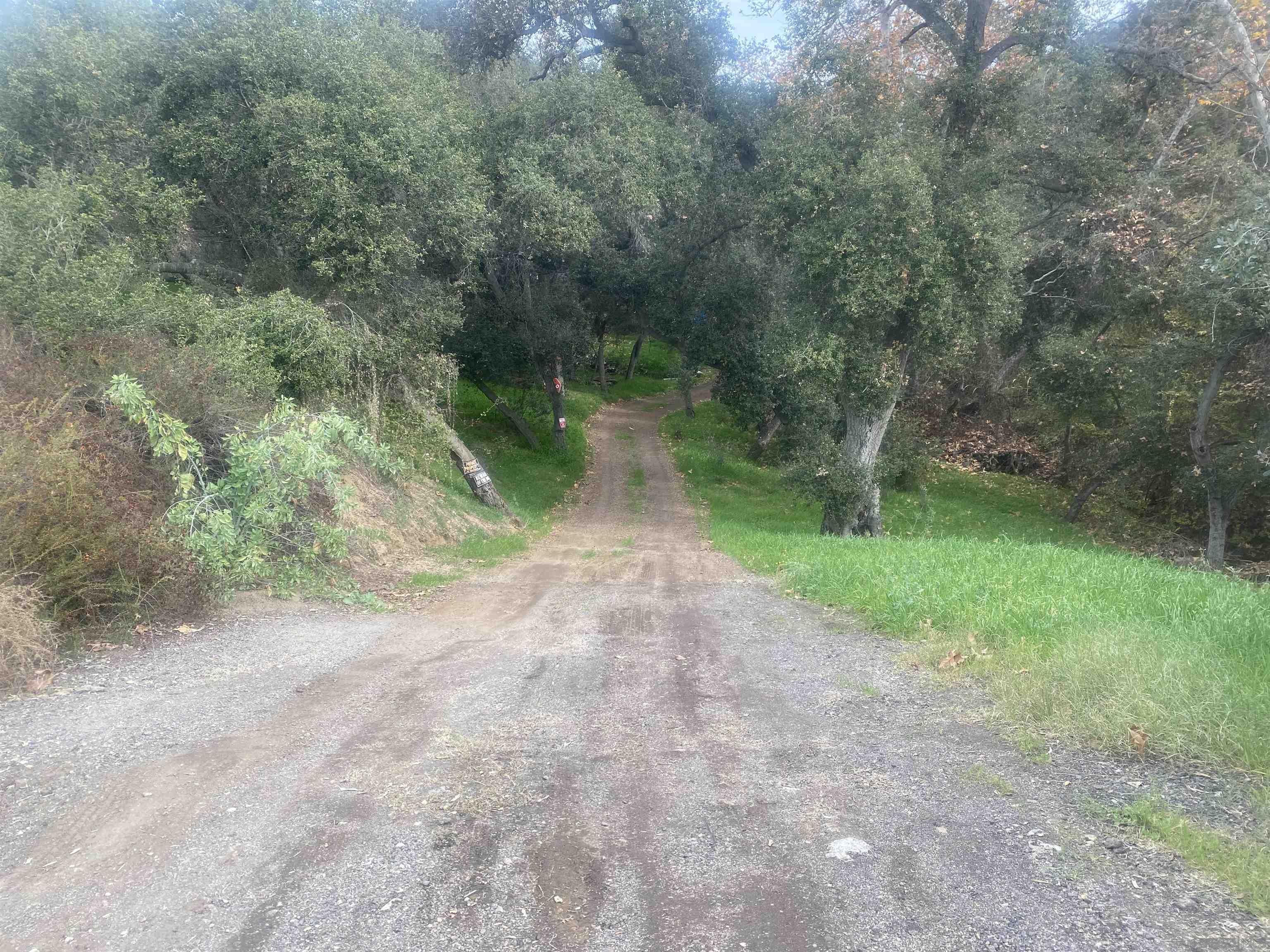 9 Lilac Road Valley Center, CA 92082 - Photo 4 of 27 a view of a dirt pathway both side of yard