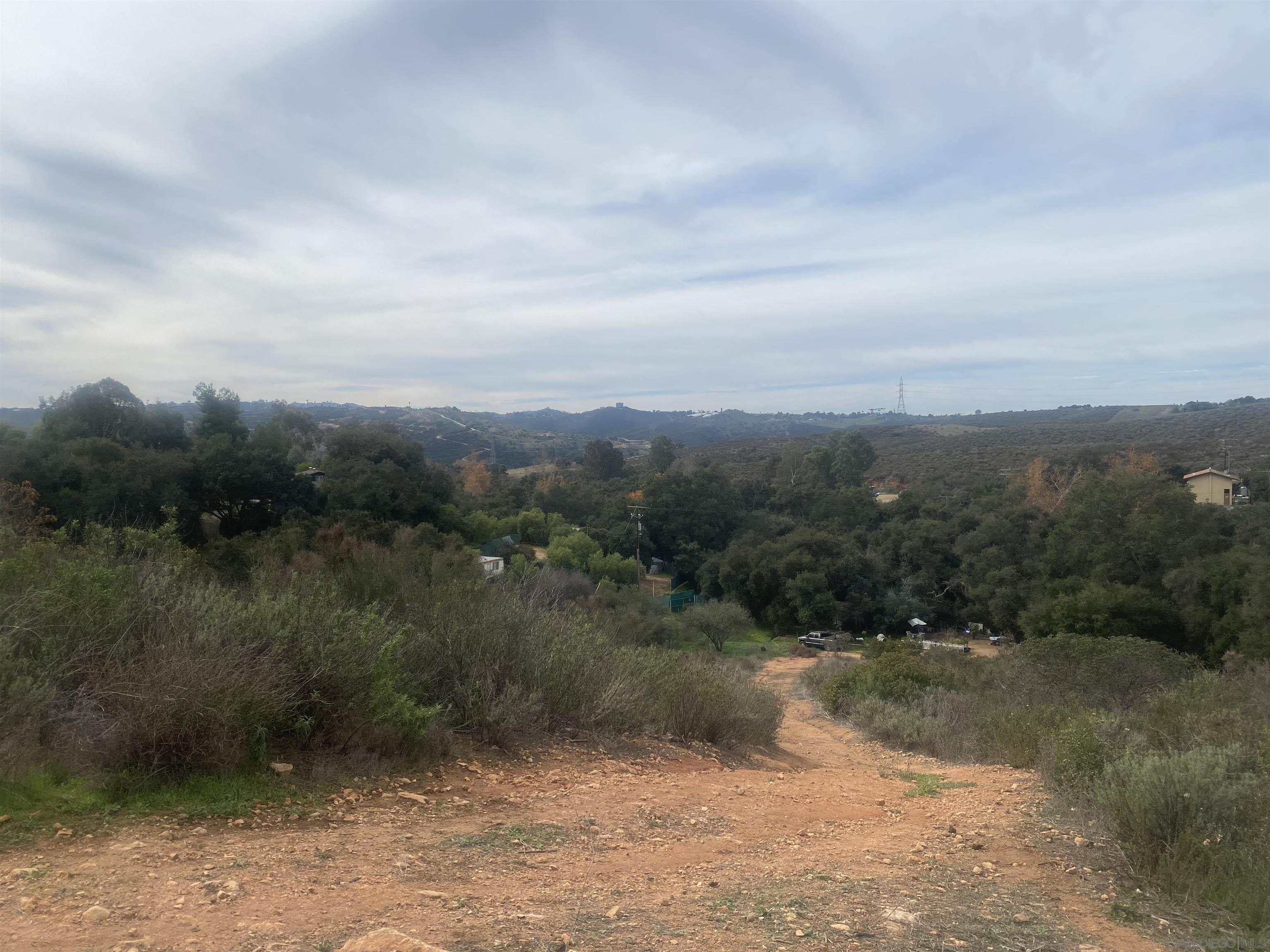 9 Lilac Road Valley Center, CA 92082 - Photo 7 of 27 a view of a lake with mountains in the background