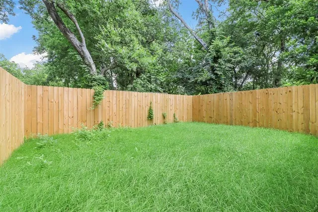 a view of backyard with tree
