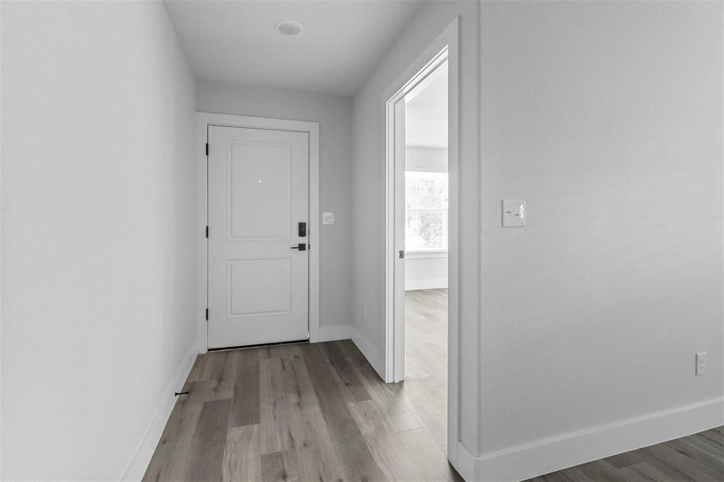 408 West 6th Street, Unit 2 Bonham, TX 75418 - Photo 4 of 16 a view of a small space with wooden floor and closet