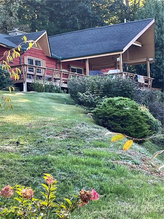44 Emerald Mountain Road Clyde, NC 28721 - Photo 1 of 33 a view of a house with a big yard and potted plants