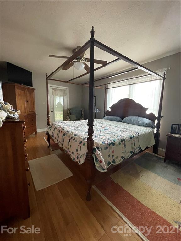 44 Emerald Mountain Road Clyde, NC 28721 - Photo 15 of 33 a bedroom with double bed and a window