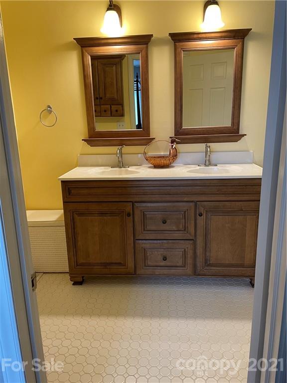 44 Emerald Mountain Road Clyde, NC 28721 - Photo 17 of 33 a bathroom with a sink and a mirror