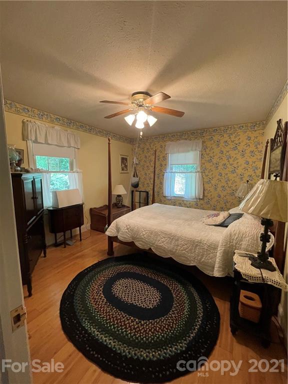 44 Emerald Mountain Road Clyde, NC 28721 - Photo 21 of 33 a living room with furniture and a chandelier