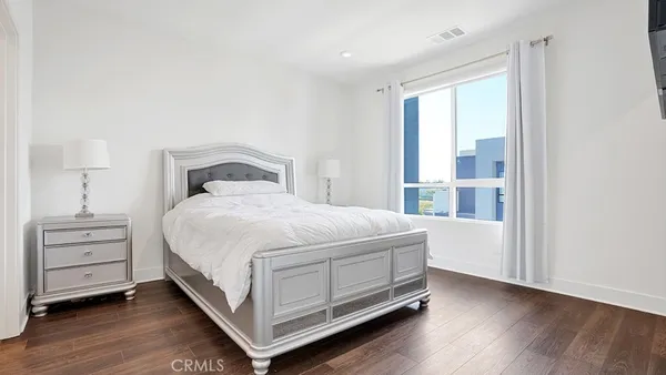 a bedroom with a bed and a closet