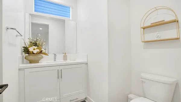 a view of a brick house that has large windows