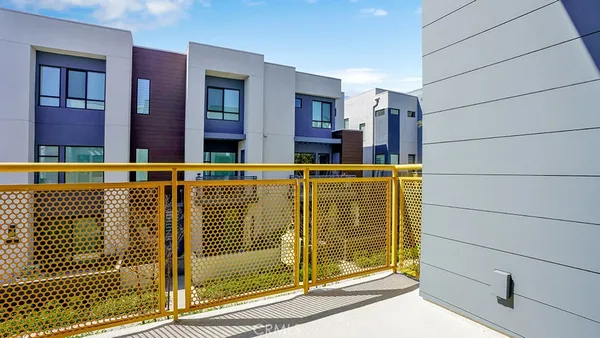 a view of a house with a yard and plants