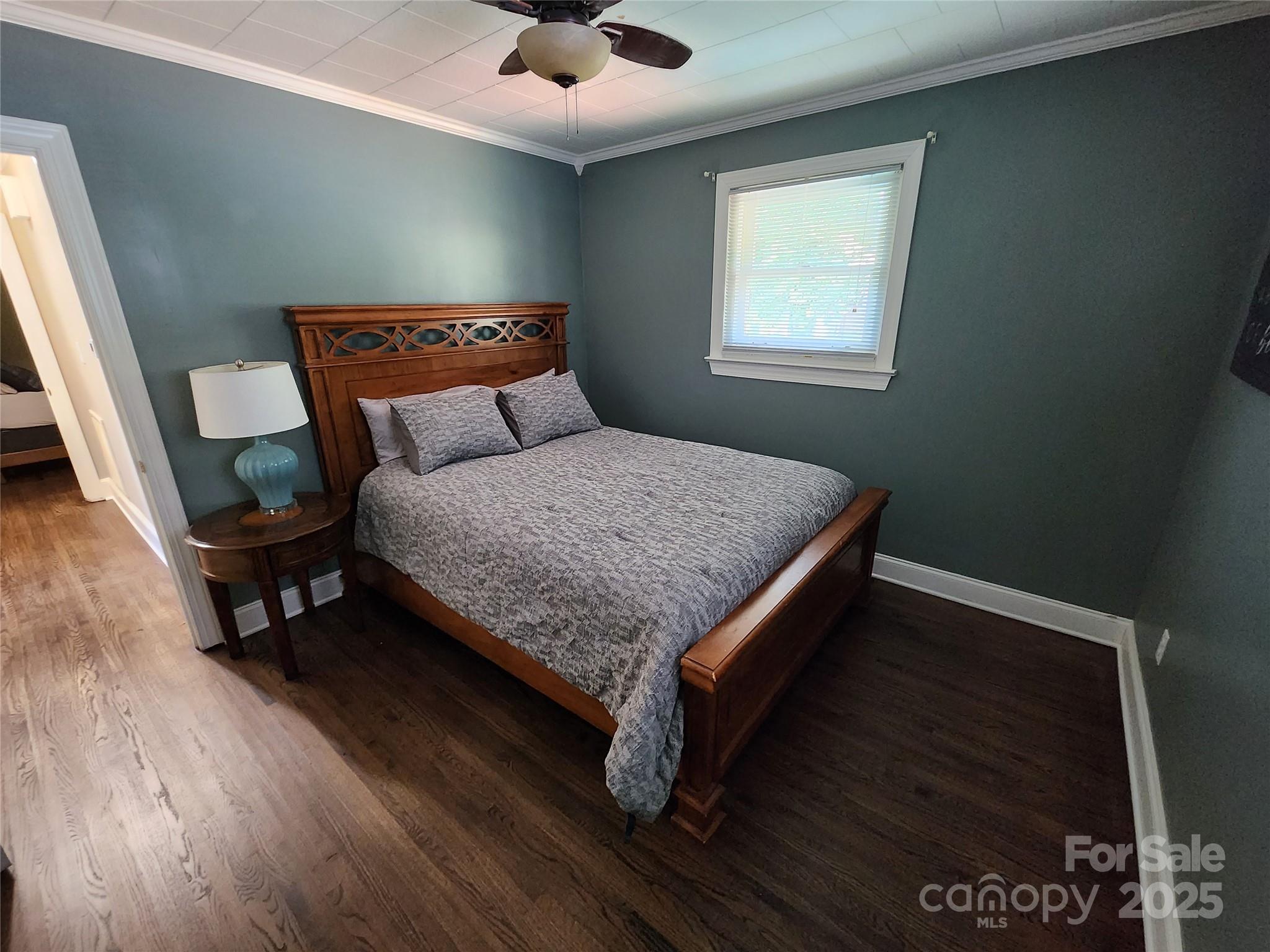 148 Palaside Drive Northeast Concord, NC 28025 - Photo 11 of 17 a bed sitting in a bedroom next to a window