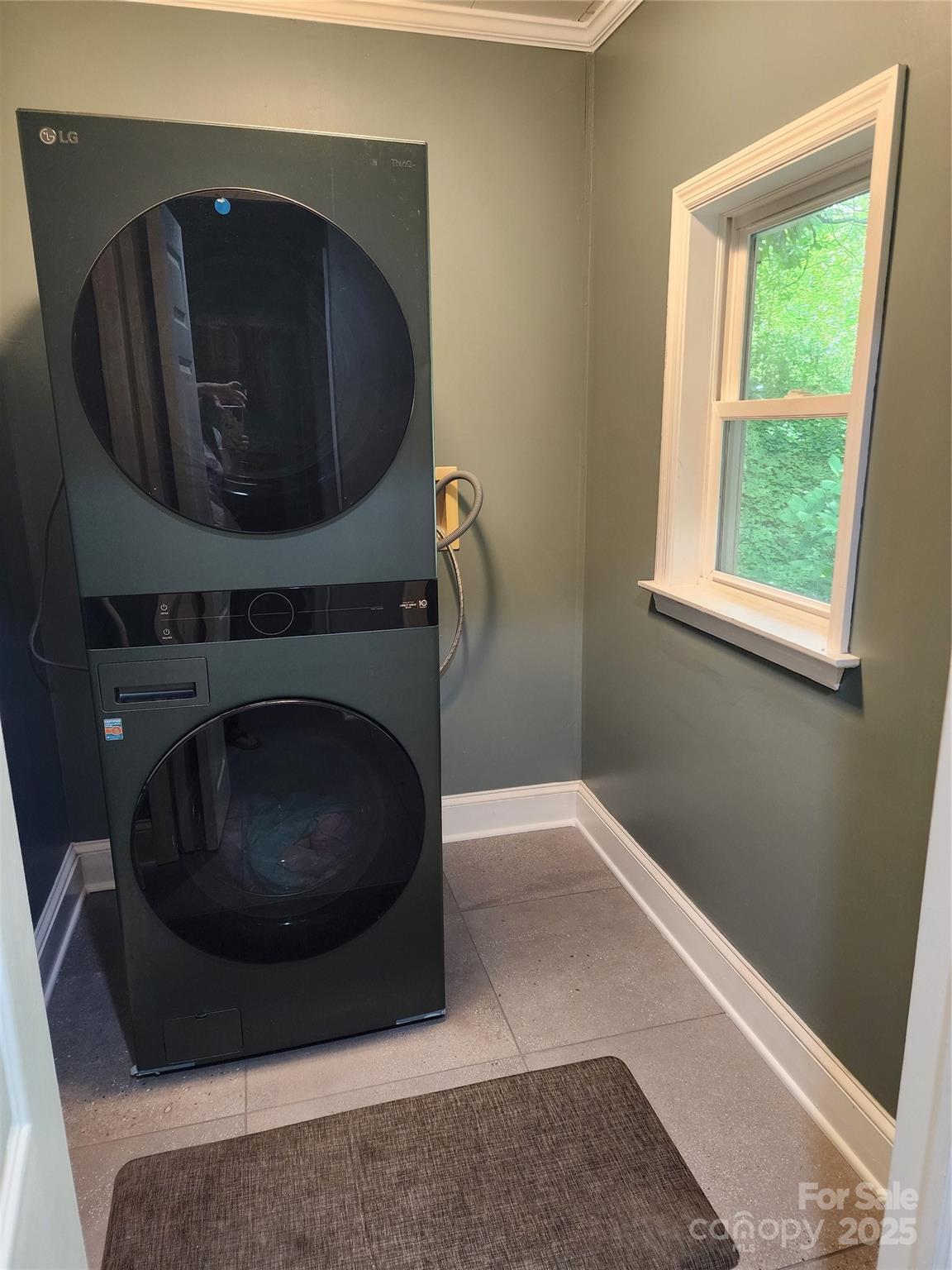 148 Palaside Drive Northeast Concord, NC 28025 - Photo 13 of 17 a living room with a washer and dryer