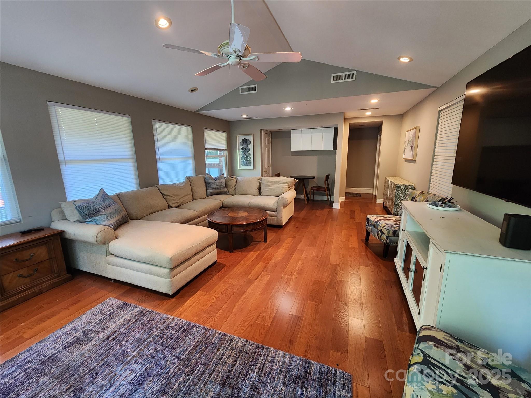 148 Palaside Drive Northeast Concord, NC 28025 - Photo 15 of 17 a living room with furniture and a flat screen tv