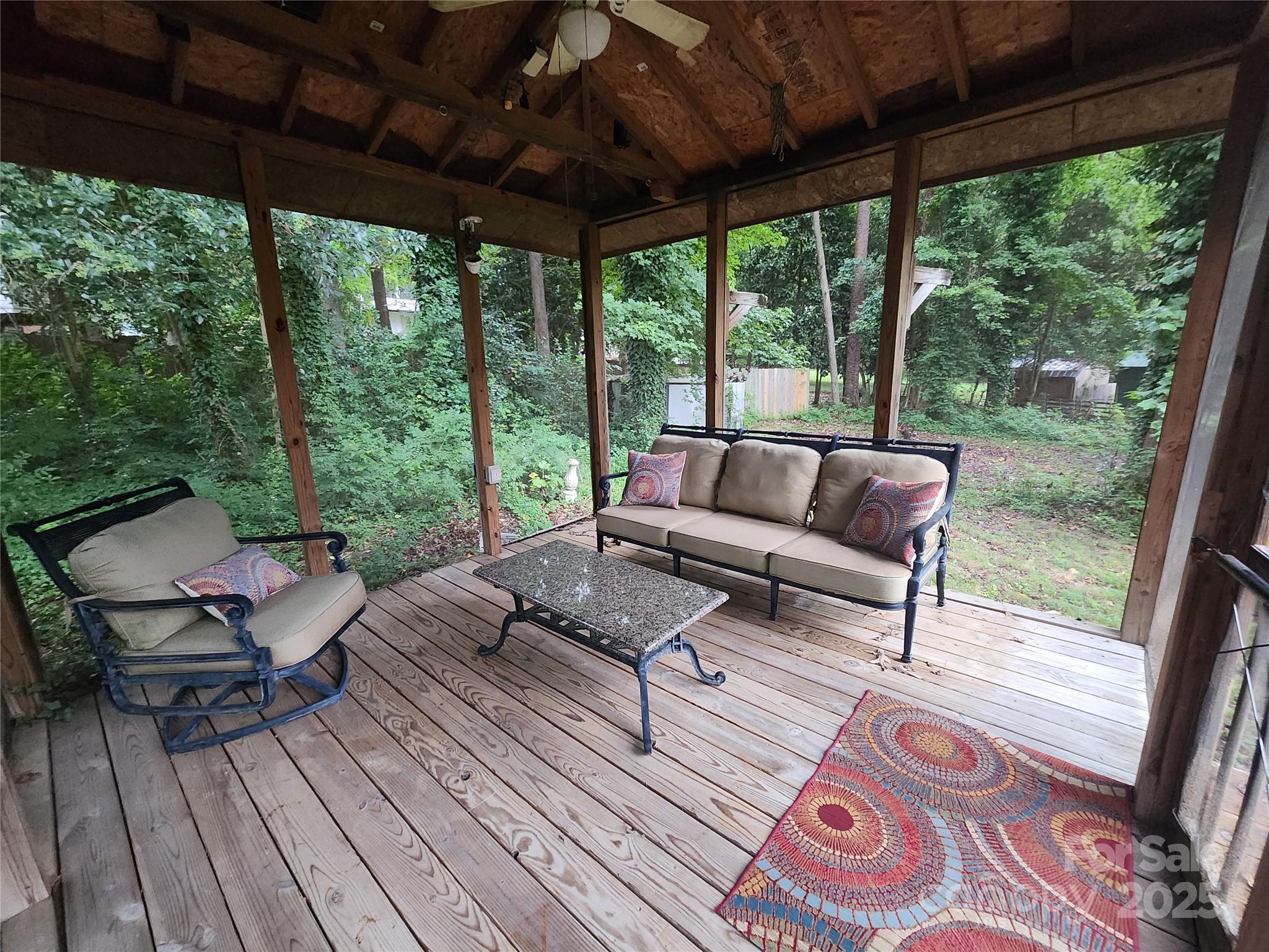 148 Palaside Drive Northeast Concord, NC 28025 - Photo 16 of 17 a outdoor space with patio the couches and a dining table with garden view