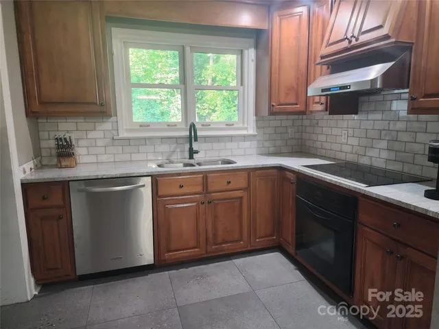 a kitchen with a sink stove and cabinets