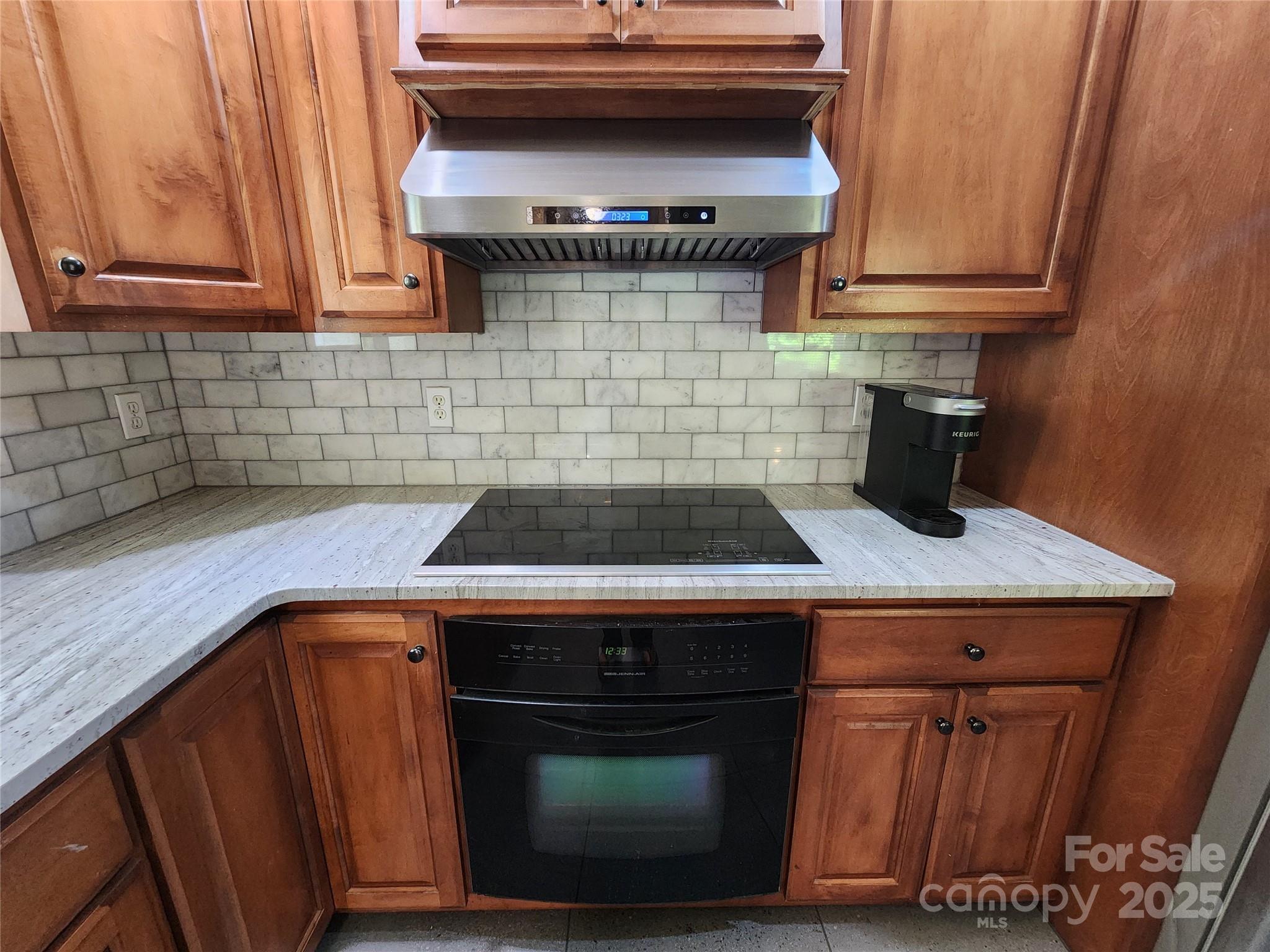 148 Palaside Drive Northeast Concord, NC 28025 - Photo 4 of 17 a kitchen with a stove and cabinets
