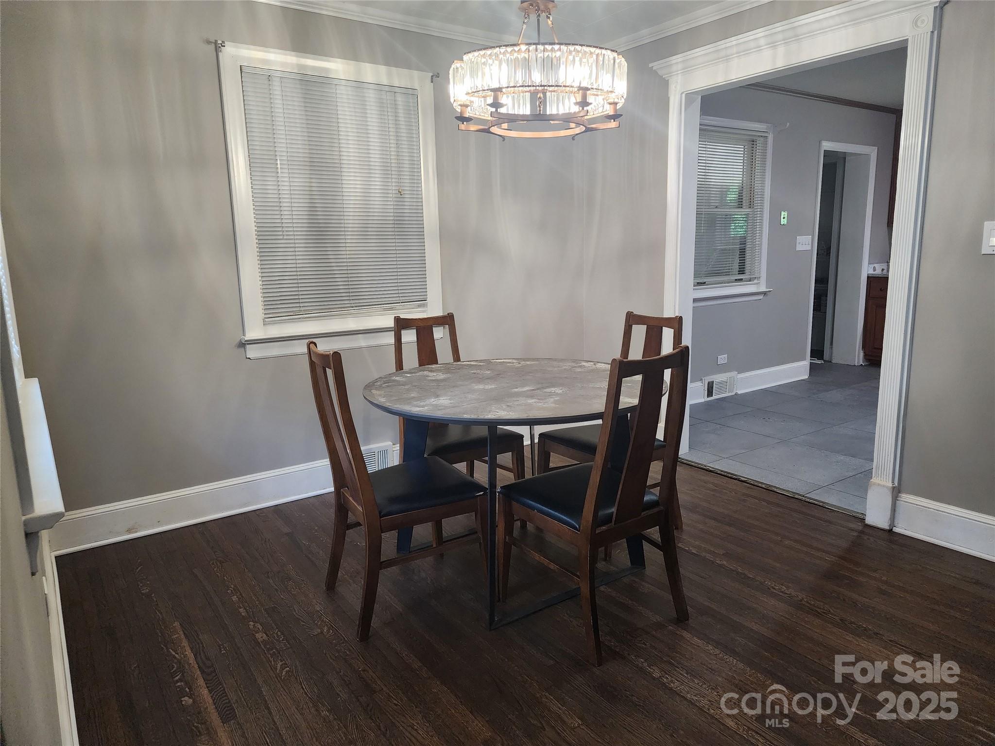 148 Palaside Drive Northeast Concord, NC 28025 - Photo 6 of 17 a view of a dining room with furniture wooden floor and chandelier