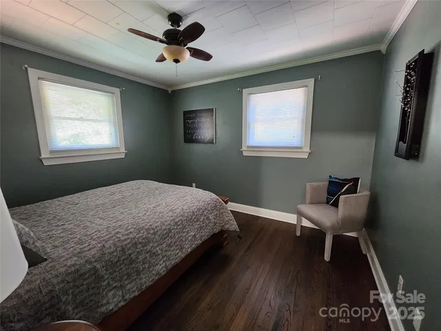 a bedroom with a bed and a chair