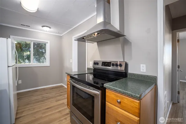 a kitchen with a stove and a microwave