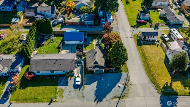 an aerial view of houses with swimming pool