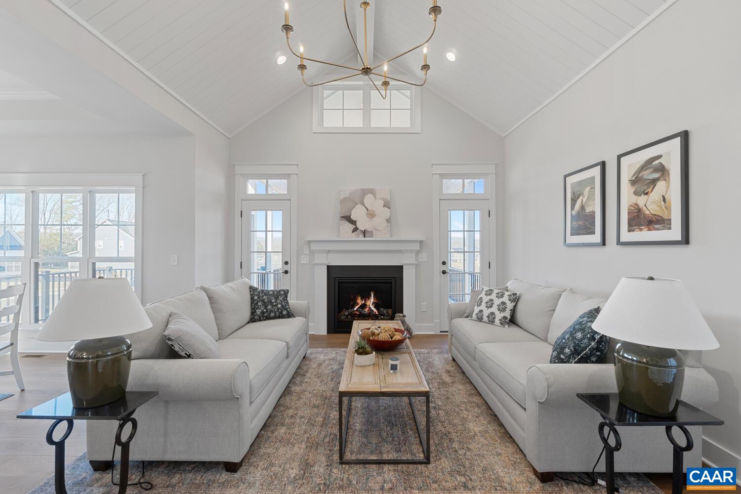 2 Agatha Ridge Lane, Unit C Crozet, VA 22932 - Photo 22 of 42 a living room with furniture a chandelier and a fireplace