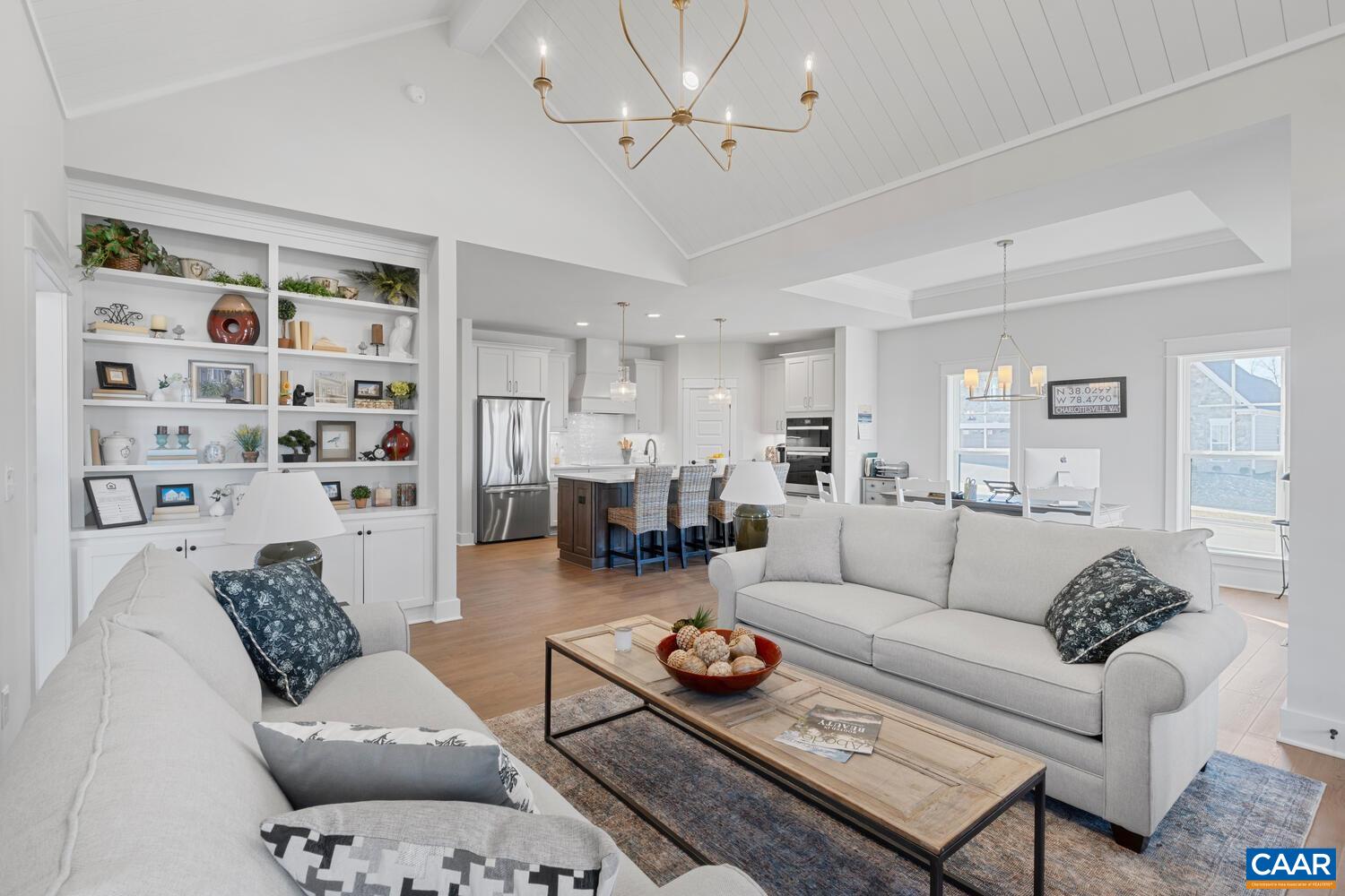 2 Agatha Ridge Lane, Unit C Crozet, VA 22932 - Photo 24 of 42 a living room with furniture a rug and a chandelier