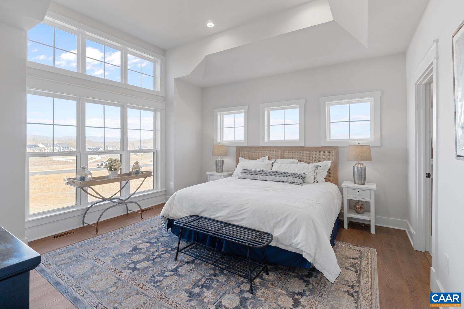 2 Agatha Ridge Lane, Unit C Crozet, VA 22932 - Photo 25 of 42 a bedroom with a large bed and a large window with outer view