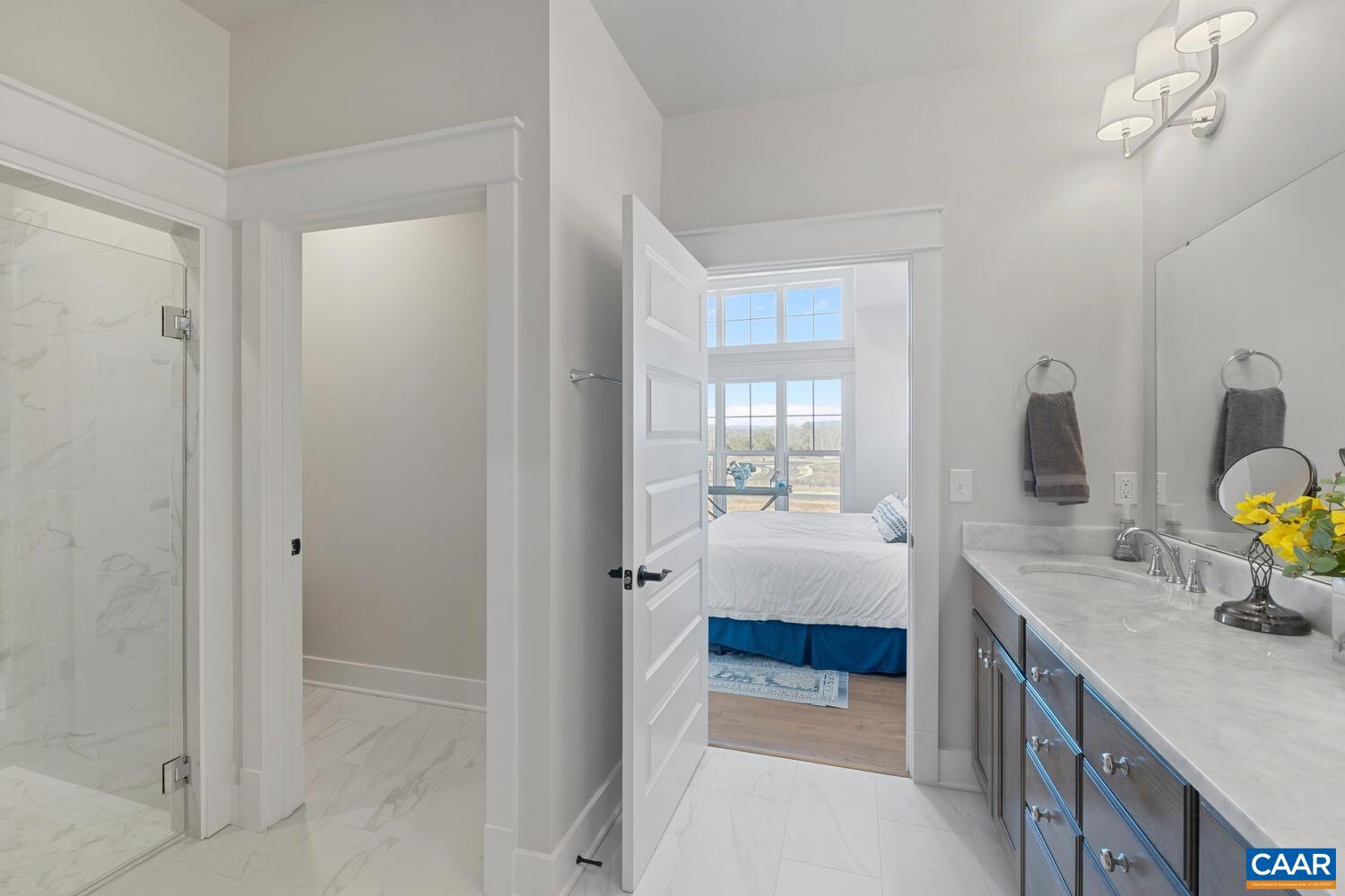 2 Agatha Ridge Lane, Unit C Crozet, VA 22932 - Photo 27 of 42 a bathroom with a tub sink and mirror