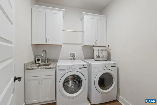 a view of kitchen sink and washer dryer