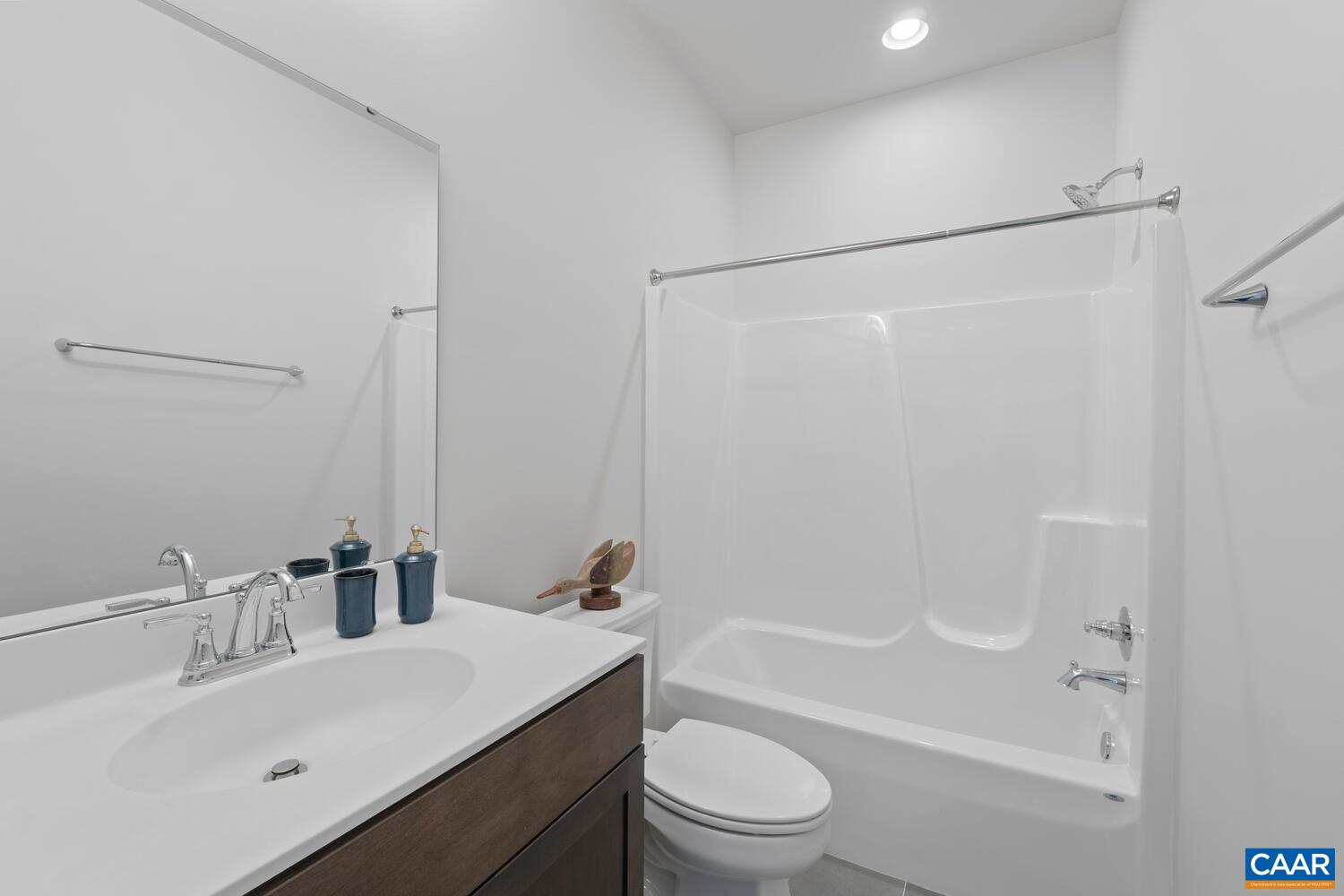 2 Agatha Ridge Lane, Unit C Crozet, VA 22932 - Photo 36 of 42 a bathroom with a bathtub shower sink vanity mirror and toilet