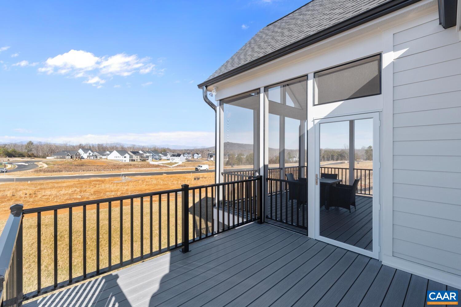 2 Agatha Ridge Lane, Unit C Crozet, VA 22932 - Photo 39 of 42 a view of a balcony with wooden floor