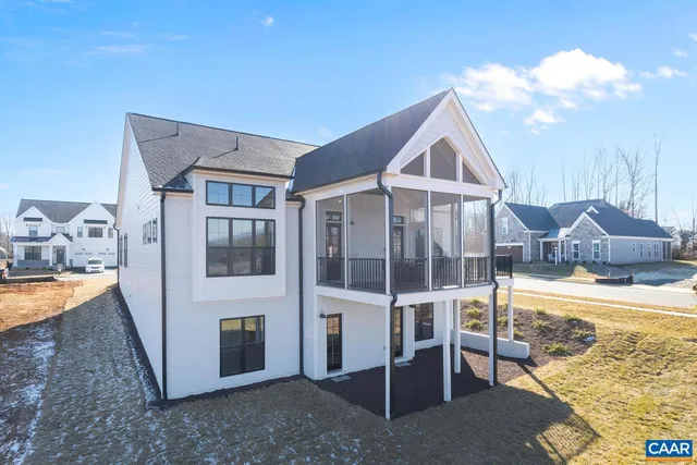 a view of a house with a yard and balcony