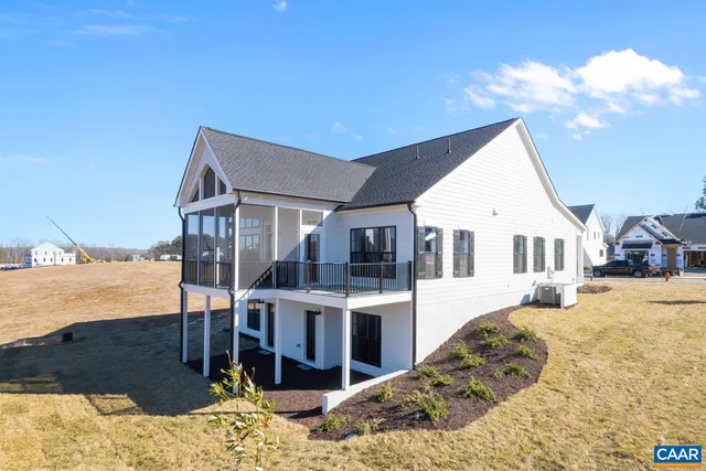 a view of residential houses with snow