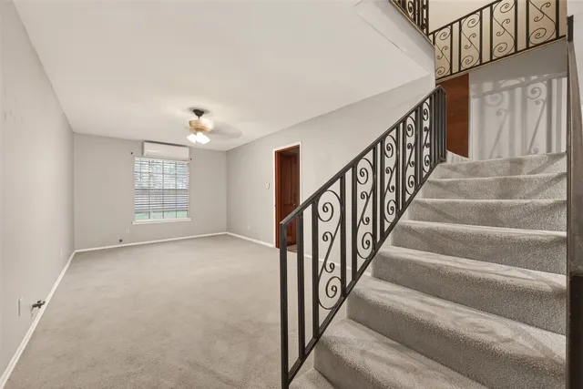 a view of an empty room with stairs