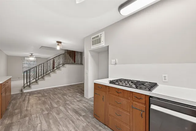 a view of kitchen with furniture and wooden floor