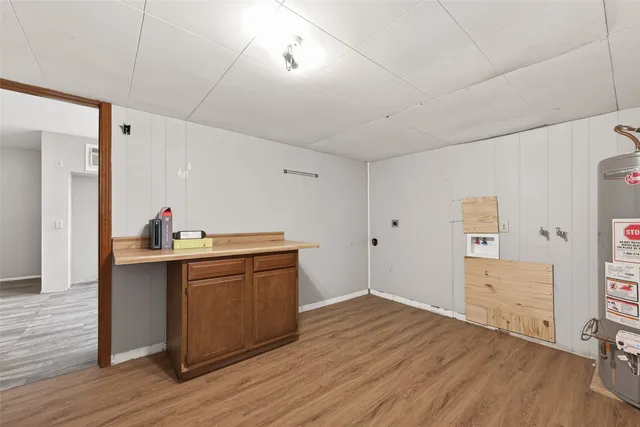 a view with wooden floor and cabinets