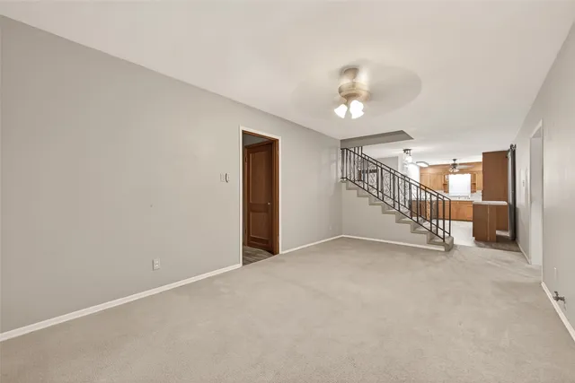 a view of an empty room with stairs