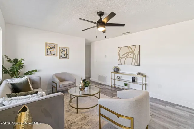 a living room with furniture and a table