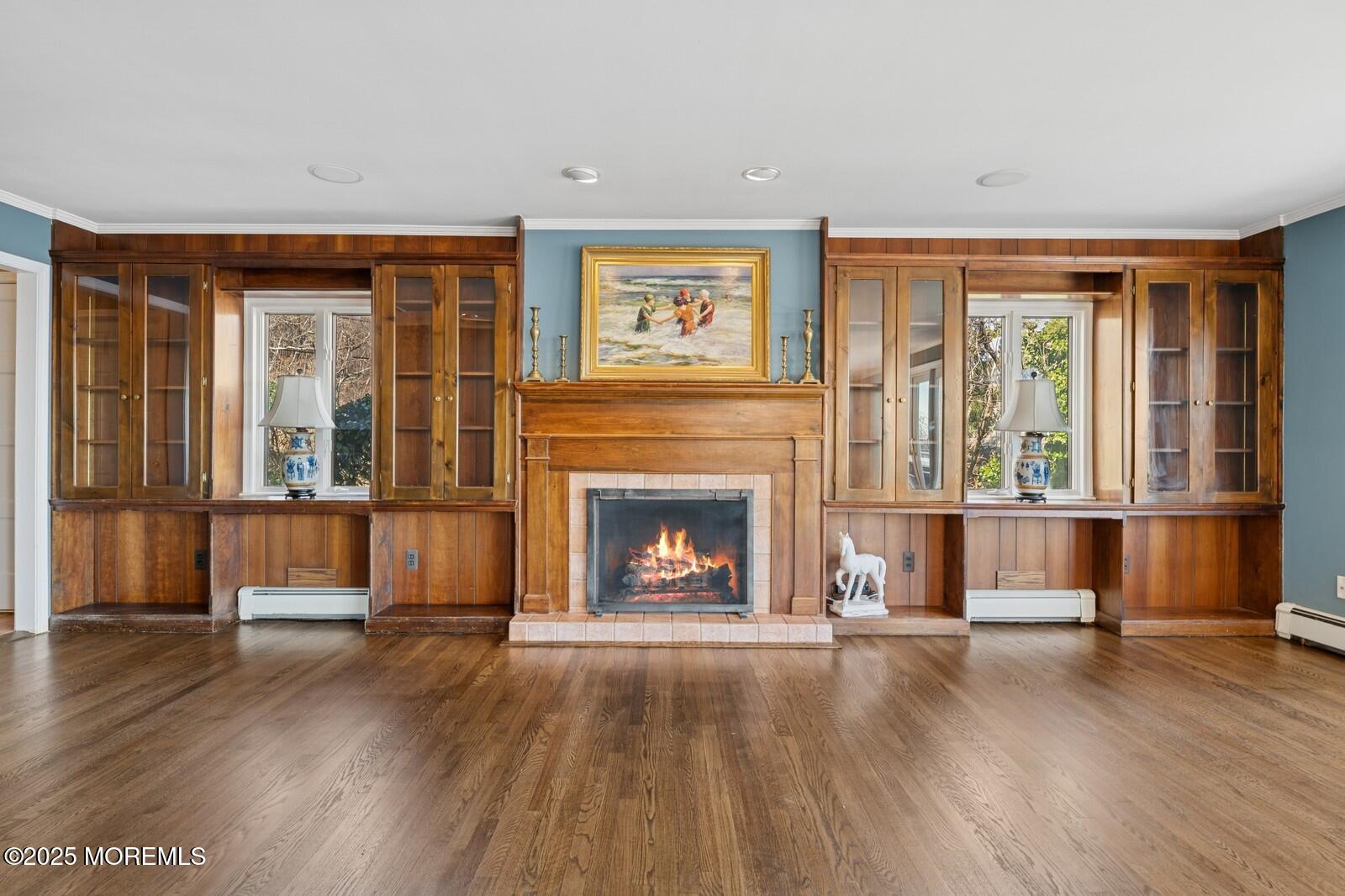 6 Hillside Road Atlantic Highlands, NJ 07716 - Photo 1 of 57 a living room with a fireplace and wooden floor