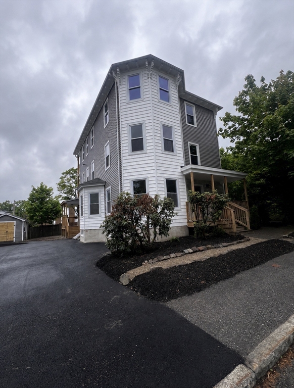19 Reeves Street Worcester, MA 01607 - Photo 2 of 30 a front view of a house with a garden