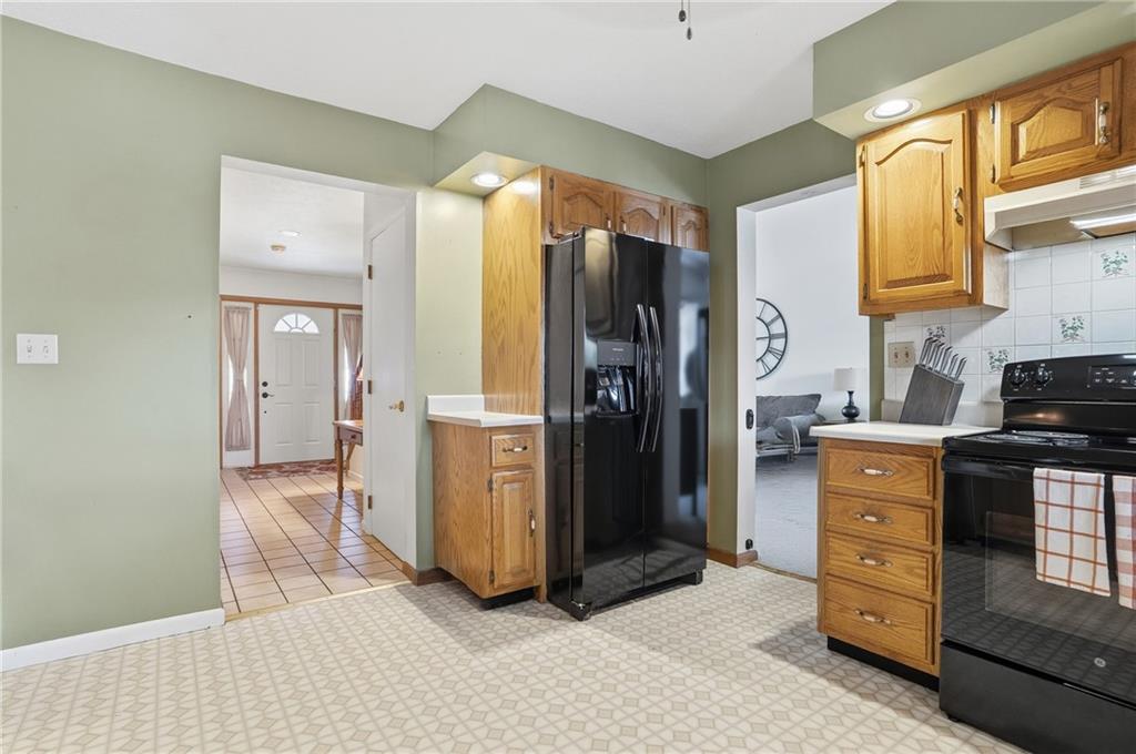 202 Holyoke Road Butler, PA 16001 - Photo 13 of 49 a kitchen with a refrigerator and a stove