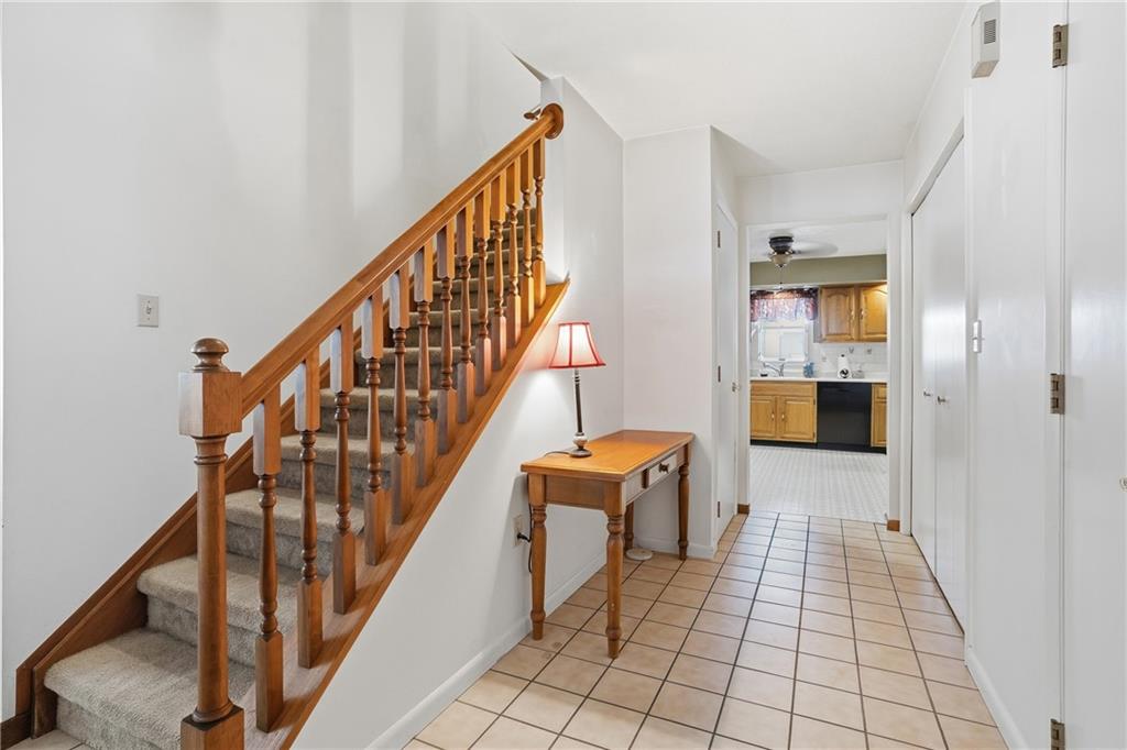 202 Holyoke Road Butler, PA 16001 - Photo 15 of 49 a view of a hallway with wooden floor and staircase