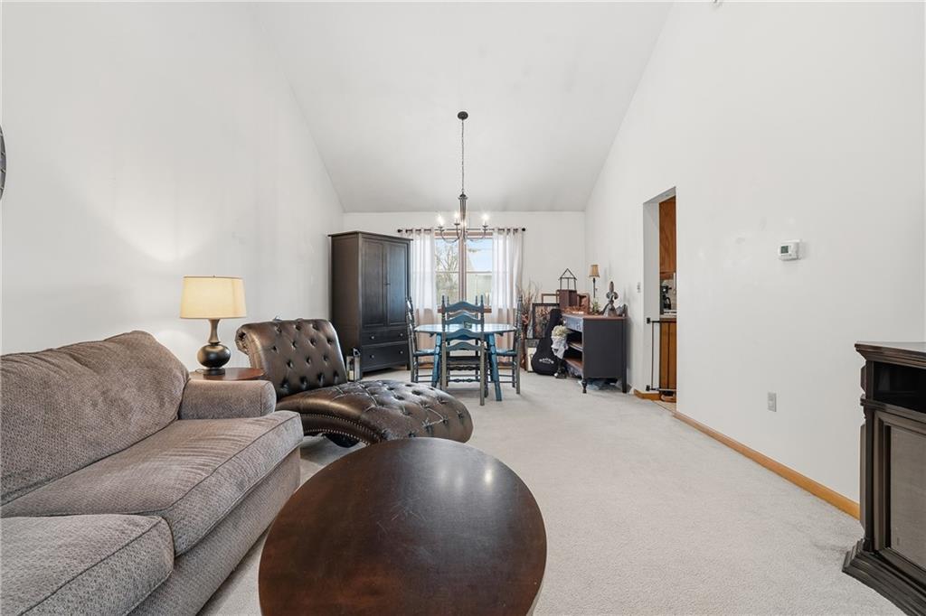 202 Holyoke Road Butler, PA 16001 - Photo 17 of 49 a living room with furniture and a chandelier