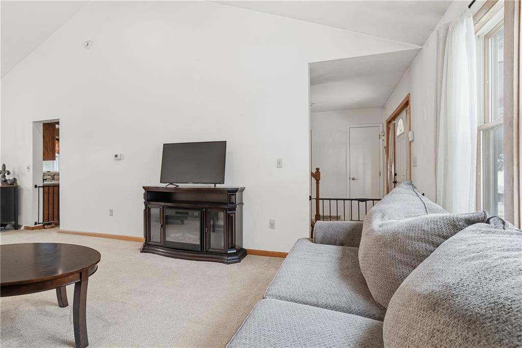 202 Holyoke Road Butler, PA 16001 - Photo 18 of 49 a living room with a couch and a flat screen tv