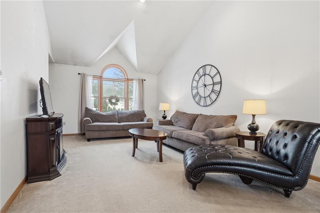 202 Holyoke Road Butler, PA 16001 - Photo 20 of 49 a living room with furniture a clock and a window