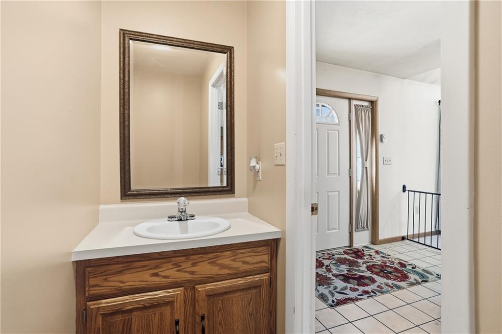 202 Holyoke Road Butler, PA 16001 - Photo 23 of 49 a bathroom with a sink a vanity and a mirror