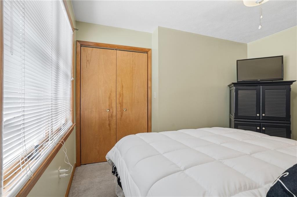 202 Holyoke Road Butler, PA 16001 - Photo 27 of 49 a bedroom with a bed and a flat screen tv