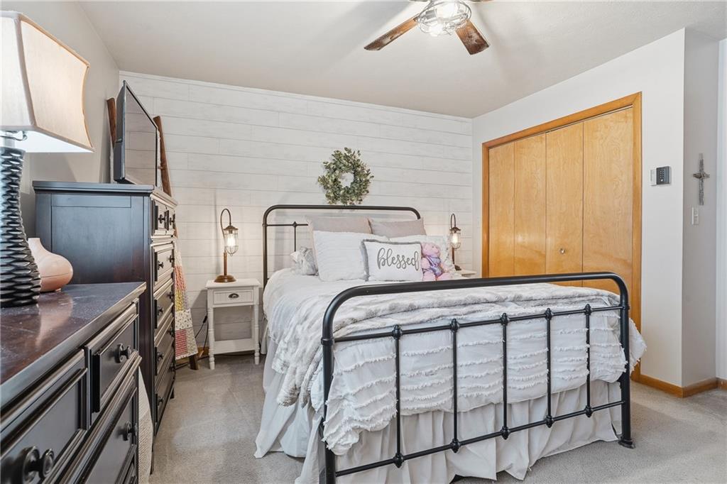 202 Holyoke Road Butler, PA 16001 - Photo 28 of 49 a bedroom with a bed and a chandelier