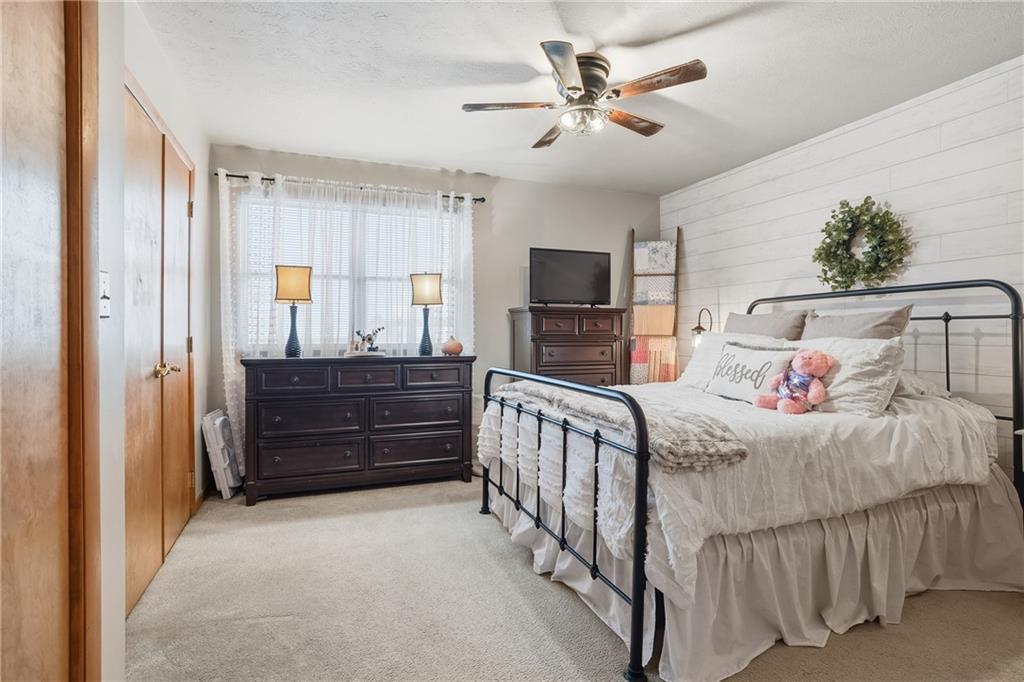 202 Holyoke Road Butler, PA 16001 - Photo 29 of 49 a bedroom with a bed and a chandelier