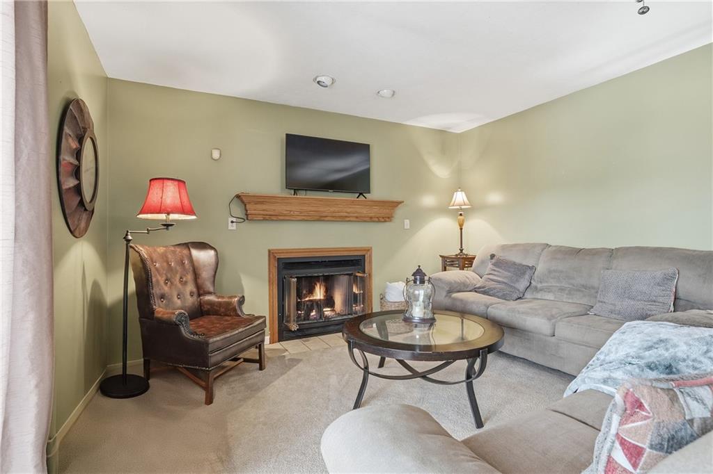 202 Holyoke Road Butler, PA 16001 - Photo 7 of 49 a living room with furniture and a fireplace